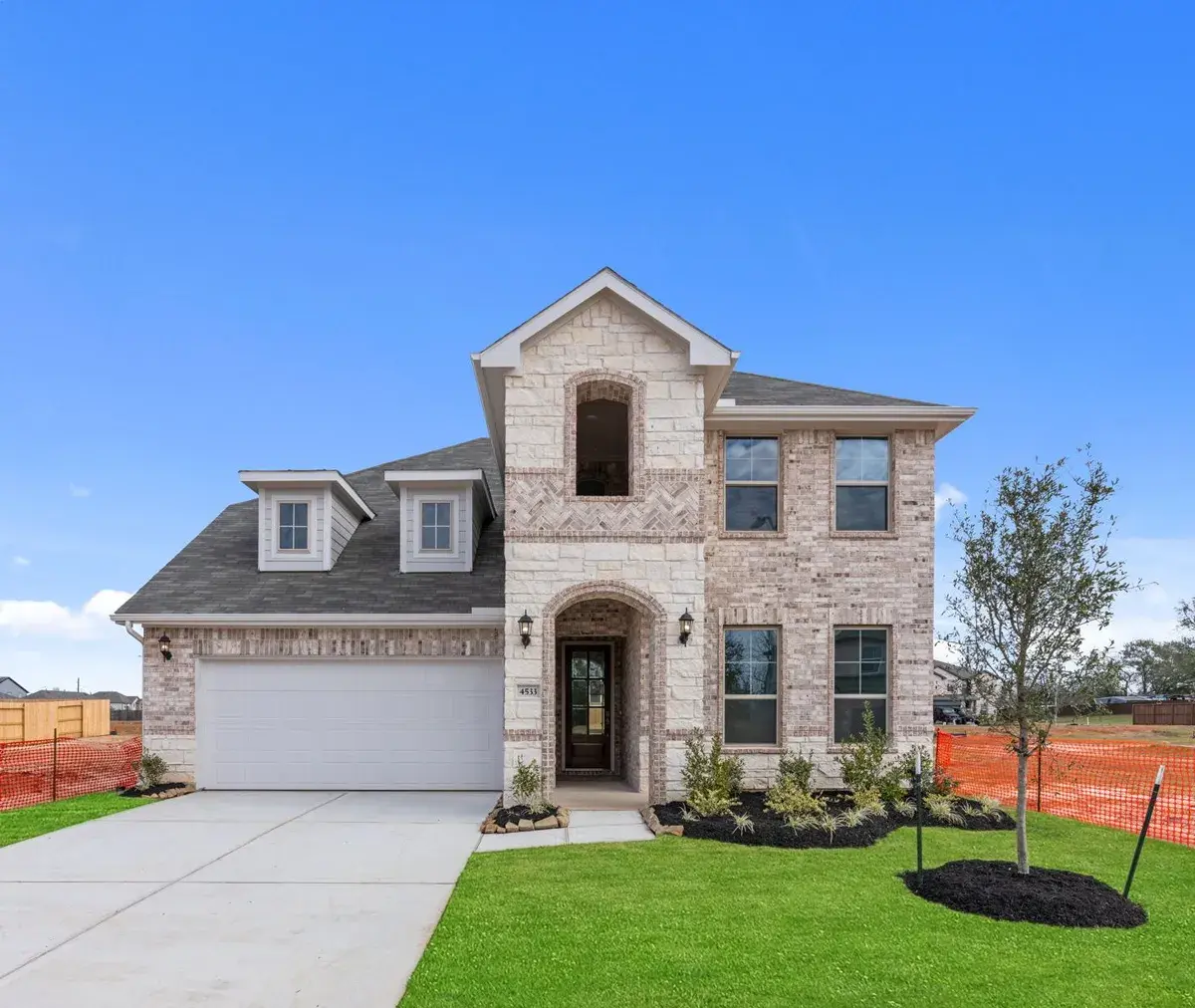Two story new construction site-built home by Brohn Homes by Clayton.