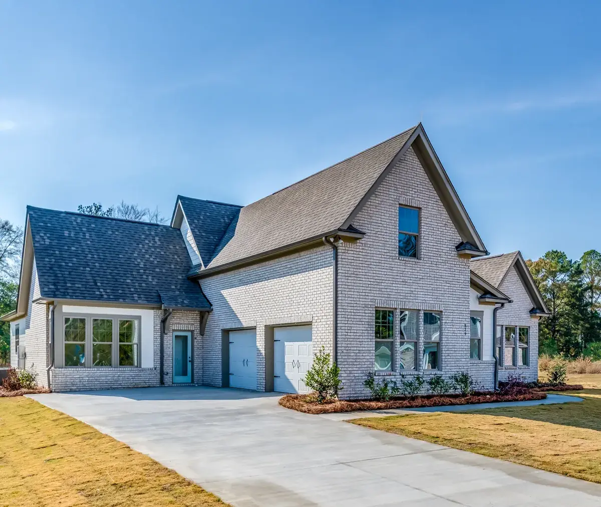 Two-story brick exterior new construction site-built home by Harris Doyle Homes, a Clayton company.