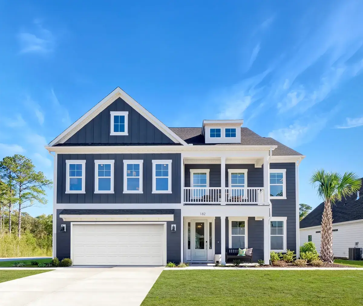 Blue and white exterior new construction two-story homes built by Mungo Homes, a Clayton company.
